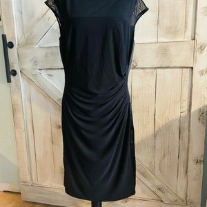 This is a black American living dress size 14